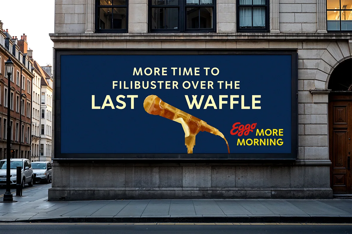 Billboard on a stone building: “More time to filibuster over the last waffle,” with a microphone made of waffle